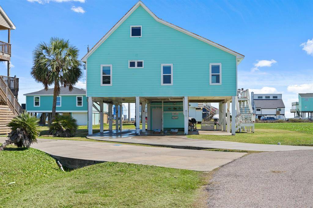 Welcome to 4111 Temprano Drive! Located just a short walk or golf cart (comes with the house!) ride to the beach! Make this dreamy beach house yours today!