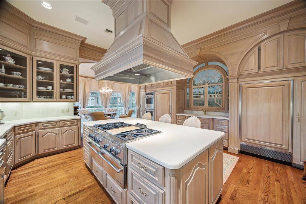 The light-filled breakfast room off the kitchen provides the perfect spot for morning coffee while enjoying views of the surrounding landscape.