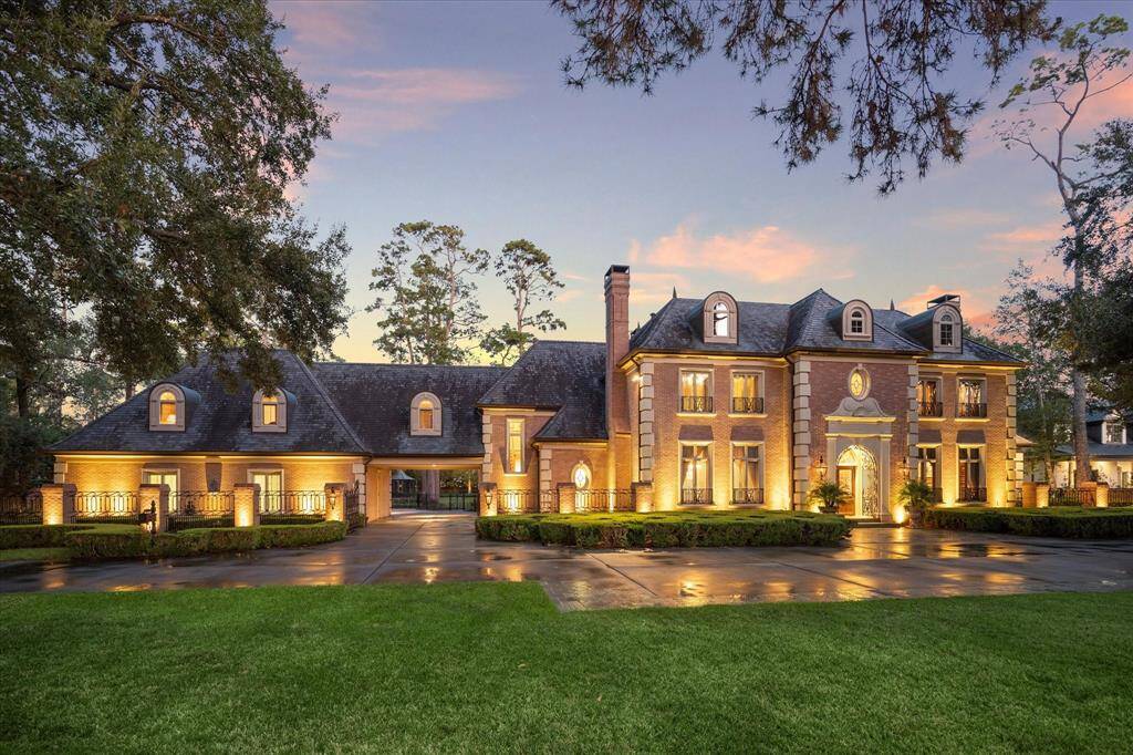 Inspired by the charm of Country French Manor Houses, this stunning residence is set on nearly 2.5 acres of meticulously manicured grounds, complete with 24/7 private security for peace of mind.