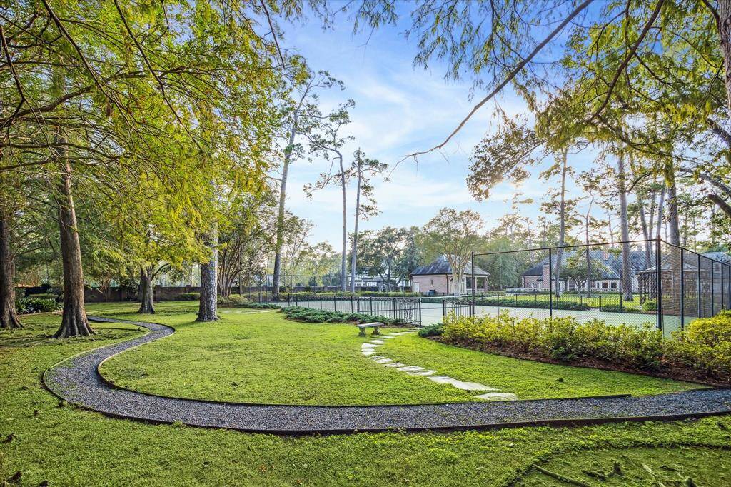 Tennis court with iron fencing.