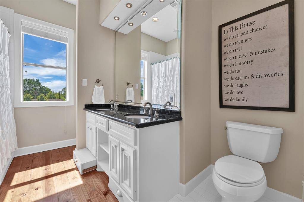 Secondary bath with custom built-in foot stool for the little ones.