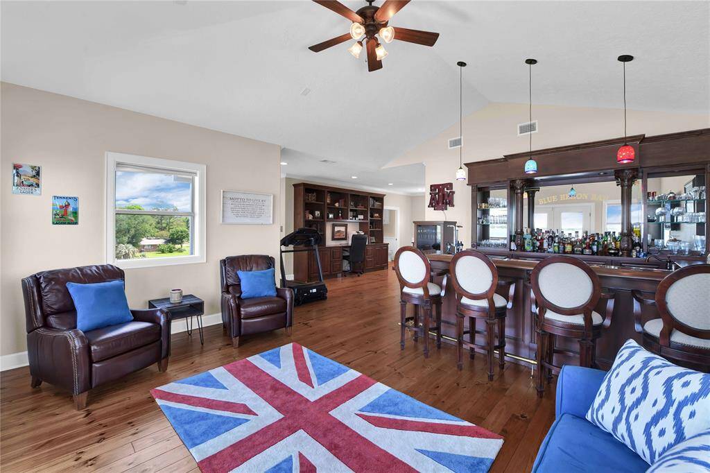 3rd story Gameroom with custom built in bar and built in desk for home office.