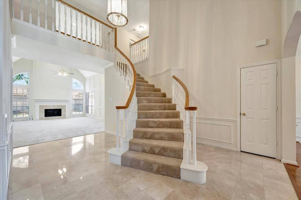 View of the stairs and living room.