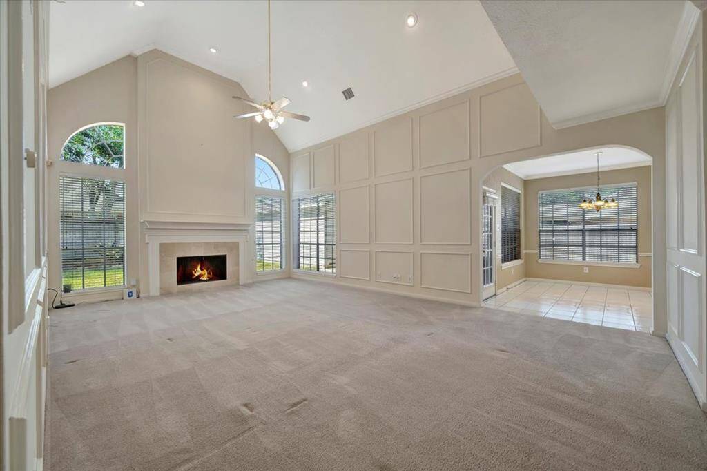 Living room with fantastic natural light and two story ceilings.