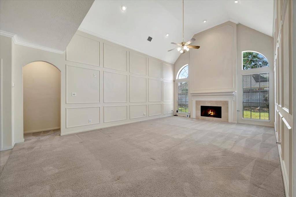 Living room leads to the primary suite through doorway on the left.