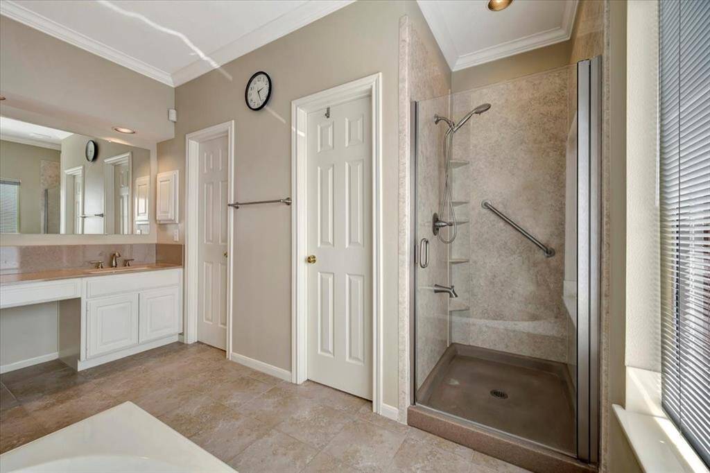 Updated walk in shower with two closets on the left.