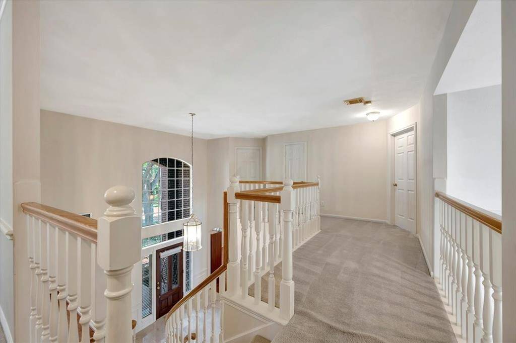 Pretty view from the top of the stairs looking to the front of the home.