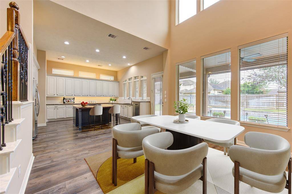 Virtually Staged Breakfast area looking into kitchen