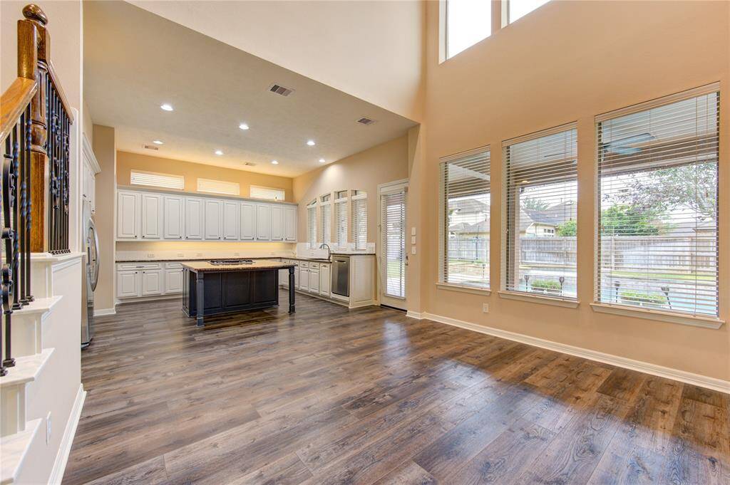 Breakfast room open to the kitchen. TONS of natural light and looks out to the resort style pool area
