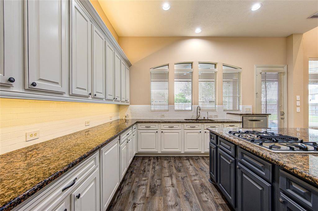 The dark blue island is a great focal point in this beautiful kitchen