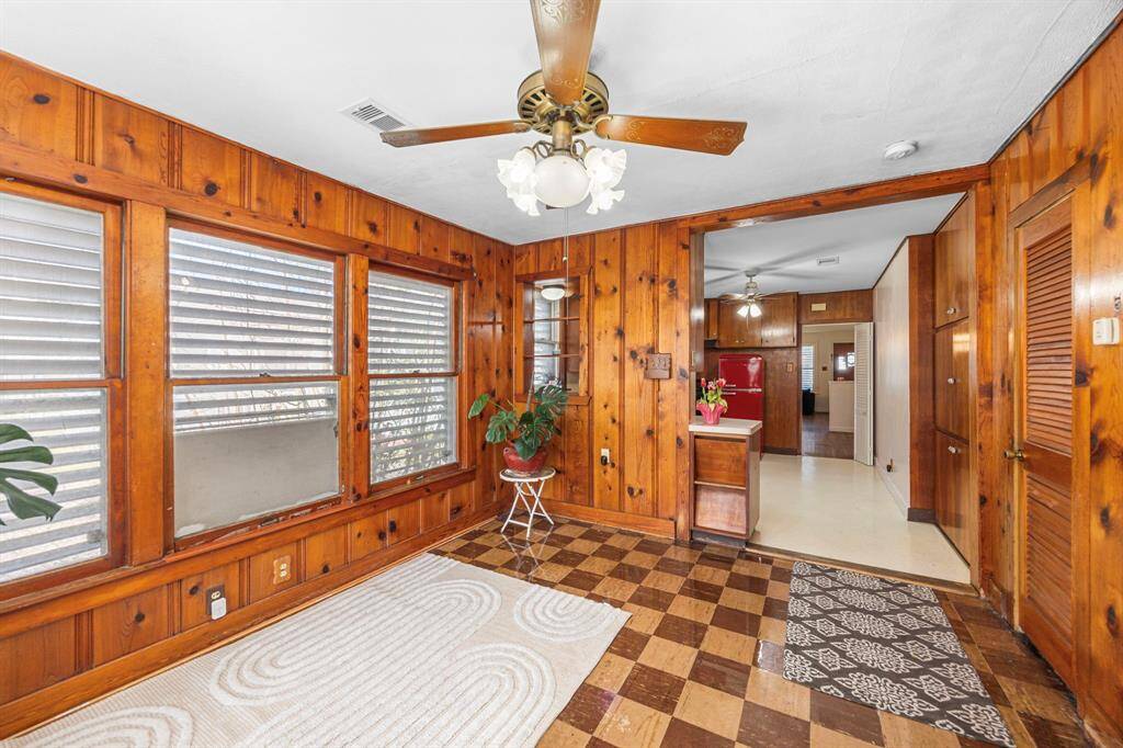 Gorgeous wood paneling and checkered floors add character.