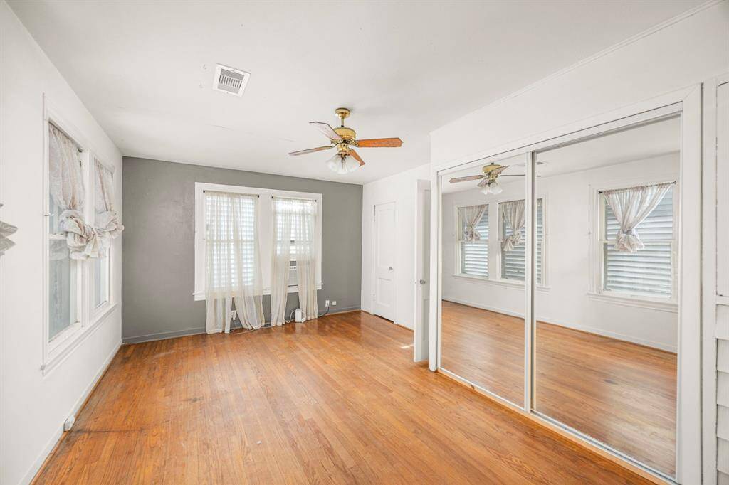 Bedroom off of the sunroom overlooking backyard.