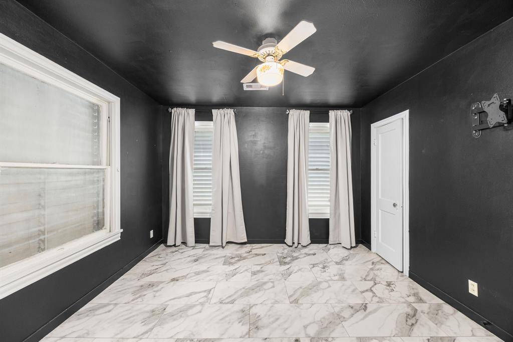 Front bedroom off of the living room. The storm shutters open to make this room light and bright!