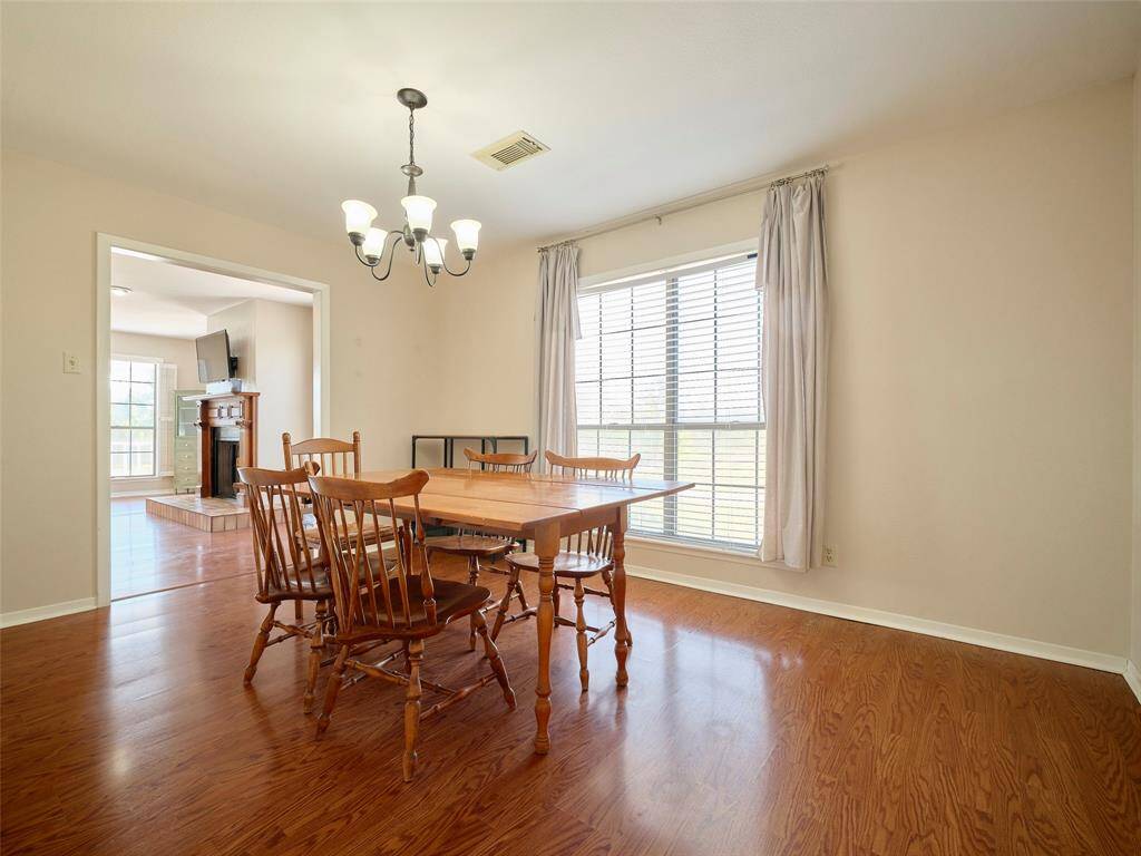Adjacent to the living area, discover a spacious dining room perfect for hosting elegant dinners and gatherings.