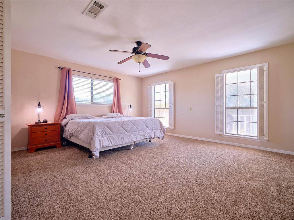 Spacious primary suite with abundant natural light.