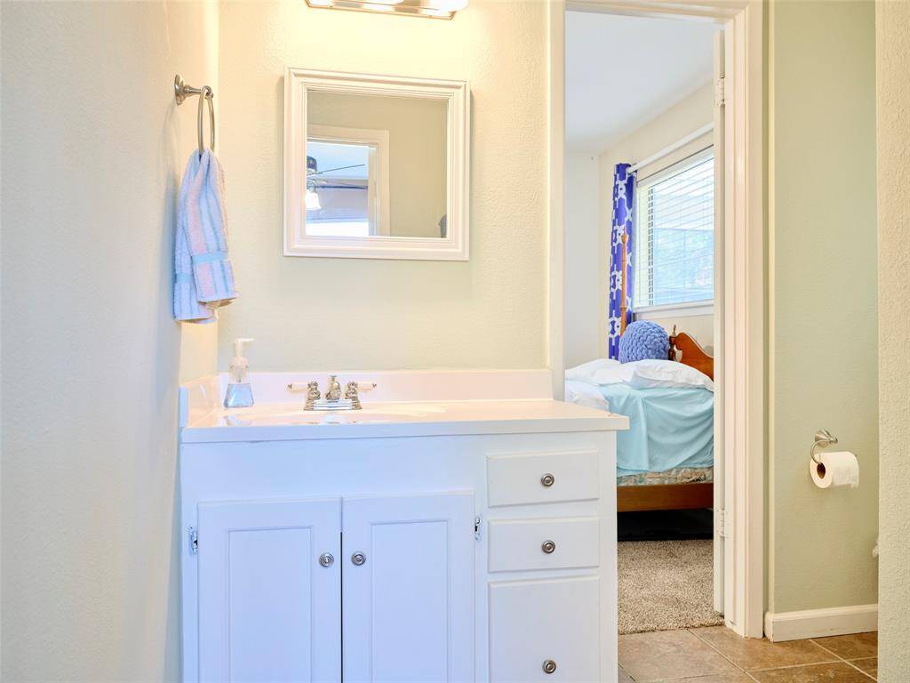 Conveniently designed Jack and Jill bathroom with dual access connecting two bedrooms, perfect for shared living while maintaining privacy.