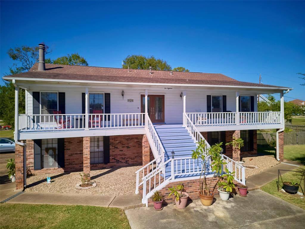 Unwind on the spacious front porch, savoring the coastal breeze.
