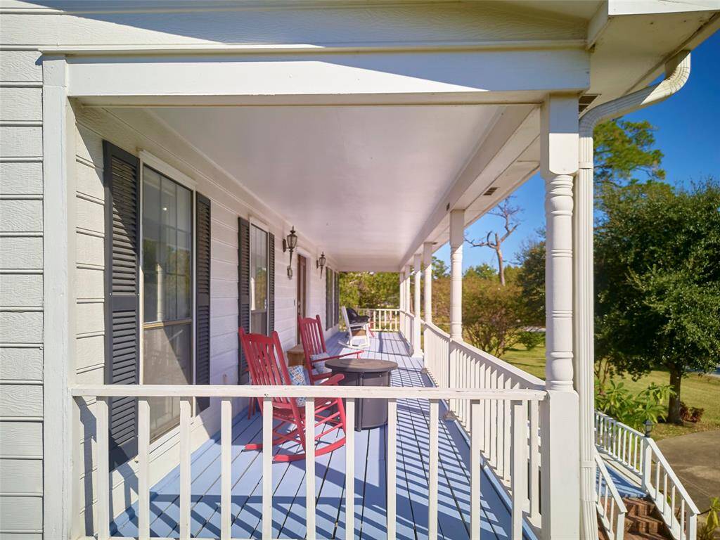 This porch is perfect for relaxation and outdoor dining.