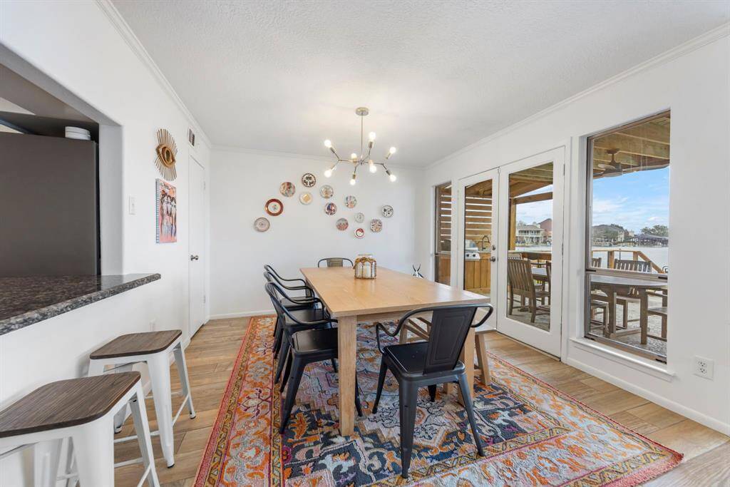 The spacious dining room offers seamless access to the back patio and features a convenient closet—perfect for storing games, hosting essentials, or extra dinnerware.