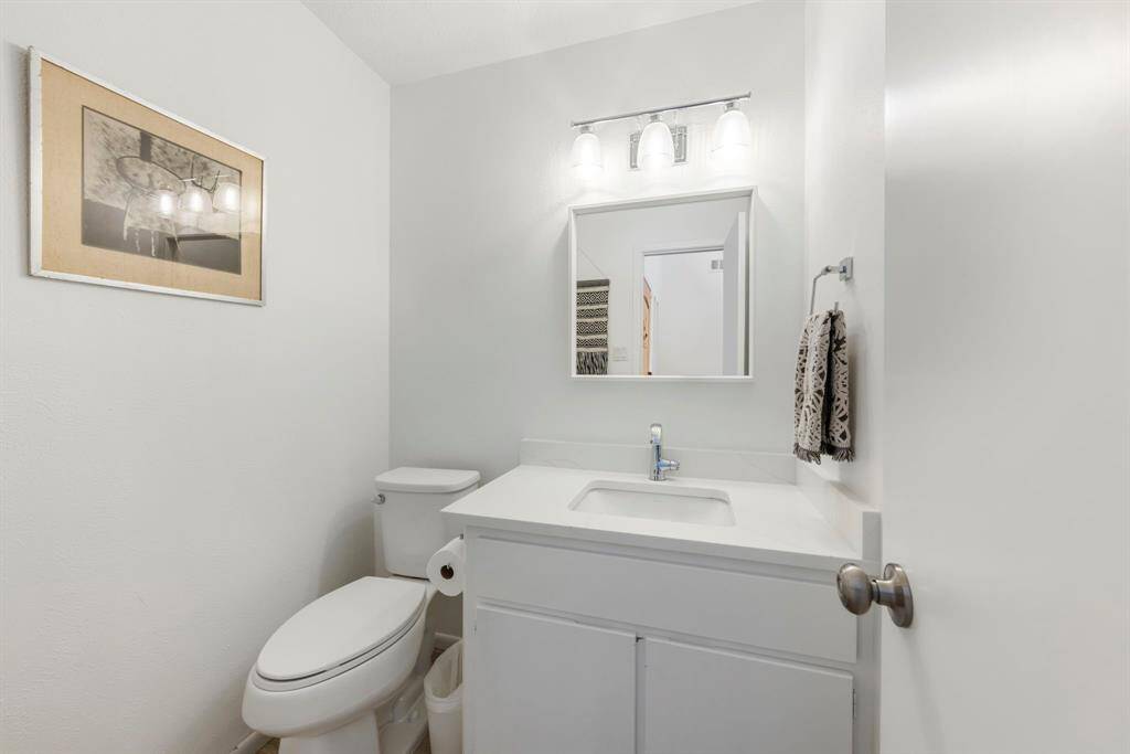 A convenient half bath on the first floor adds ease and accessibility for guests.