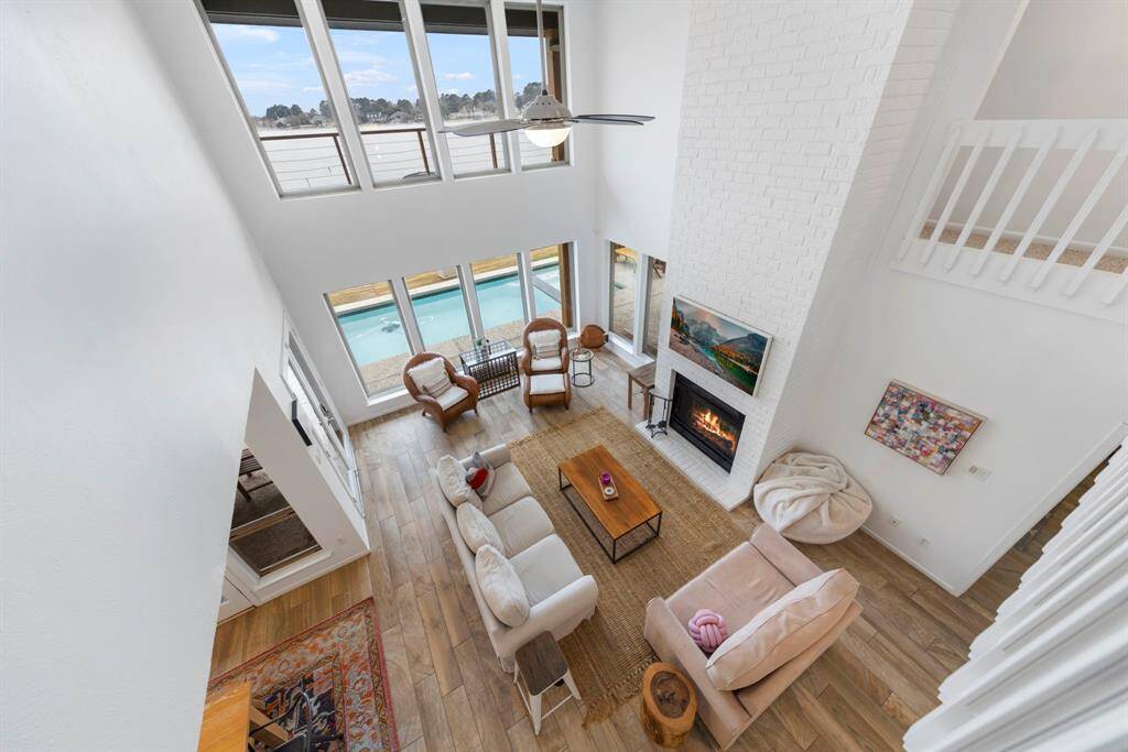 A stunning second-floor view—lake views in every direction, bringing the beauty of the water right into your home!