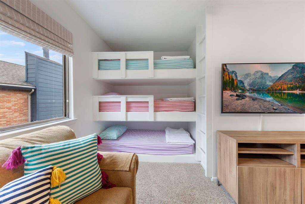 Charming built-in bunk beds, perfect for kids or extra guests!