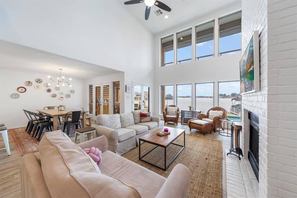 The open-concept first floor seamlessly connects the family room and dining room, both offering direct access to the back patio for effortless indoor-outdoor living.