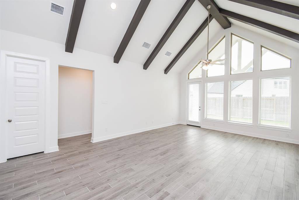Spacious living room with stunning beam detailing.
