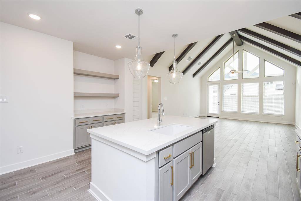 Gourmet kitchen featuring a large island and ample counter space.