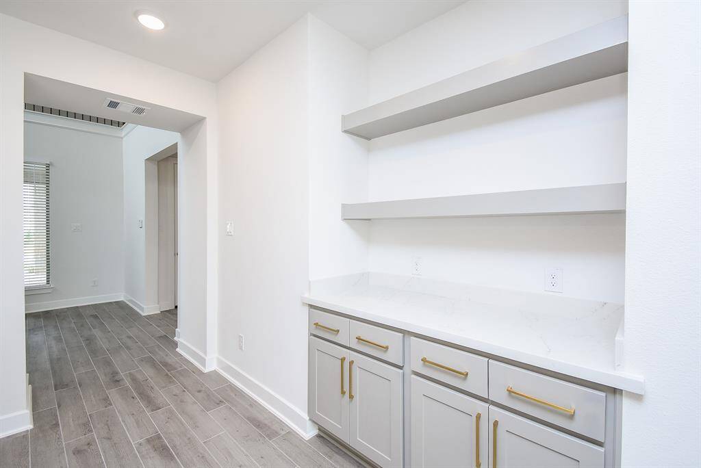 Built-in storage and shelving for optimal functionality.