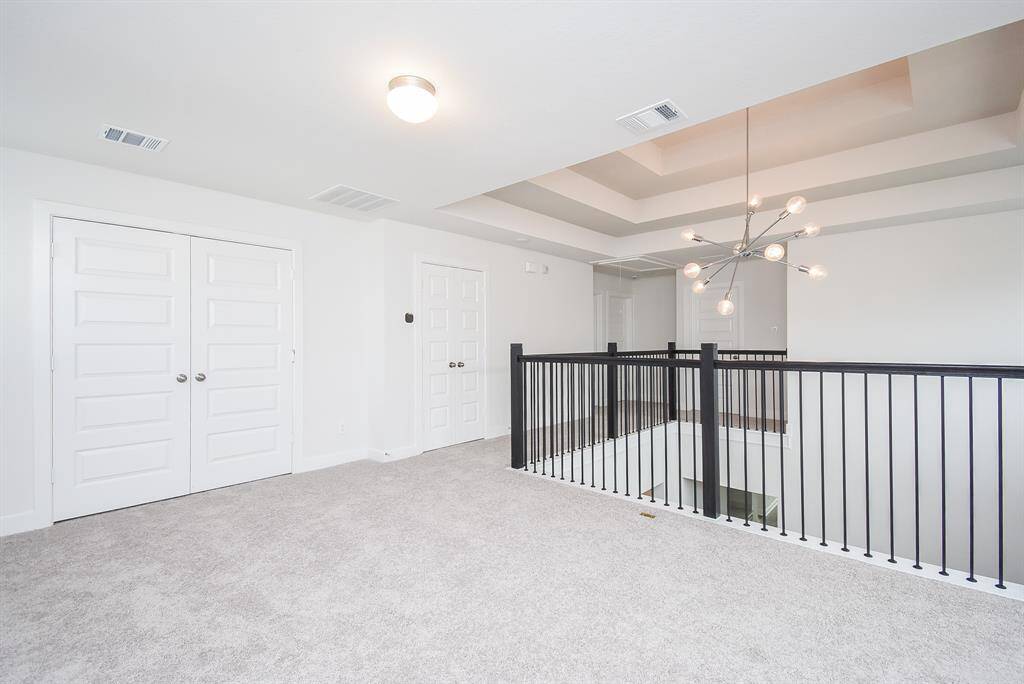 Open loft area ideal for a game room or additional living space.