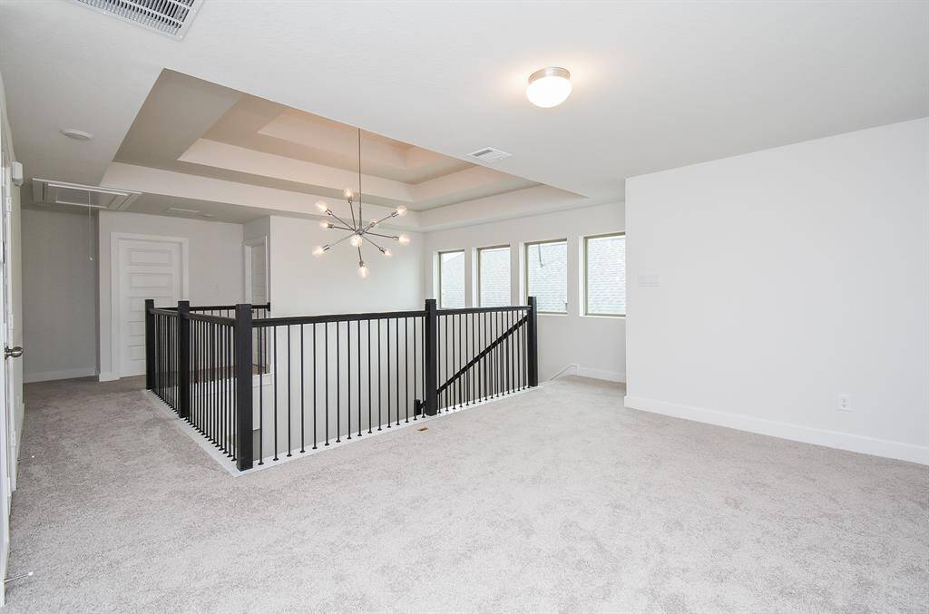 Airy upstairs space overlooking the living area, perfect for relaxation.