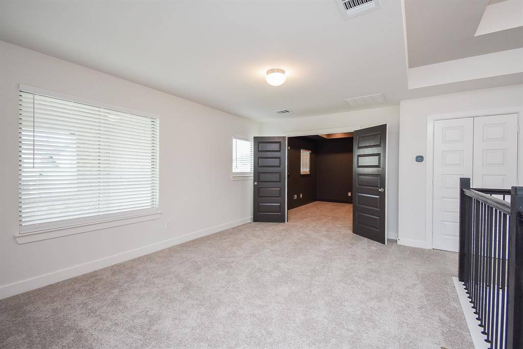 Expansive upstairs family room with endless possibilities for customization.