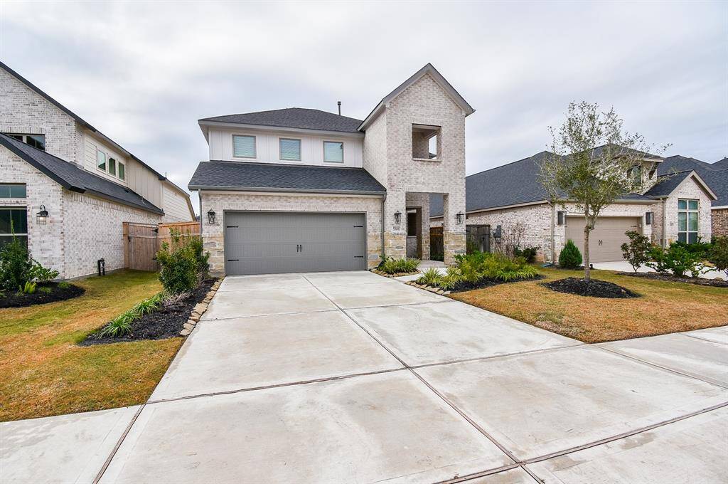 Stunning modern home with a spacious driveway and excellent curb appeal.