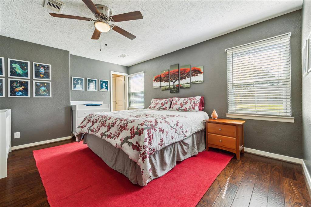 The primary suite is a peaceful haven, with a generous layout and ambiance. The adjoining spa-like bathroom features a perfect balance of style and functionality.