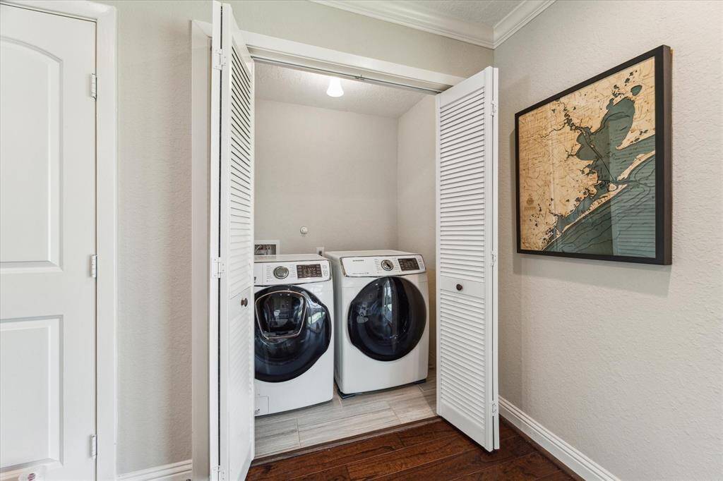 The laundry area is situated off the bonus area. Quickly throw in a wash between activities, combining functionality with convenience in one well-organized spot.