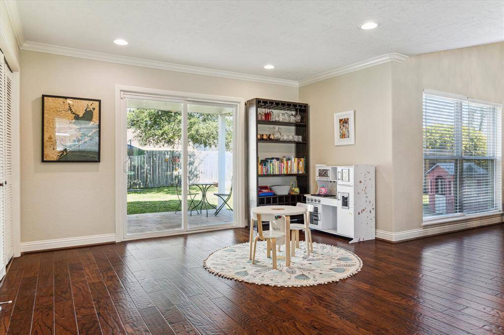 An abundance of windows fills the space with natural light. Surrounding views of the backyard, bringing the outdoors inside.