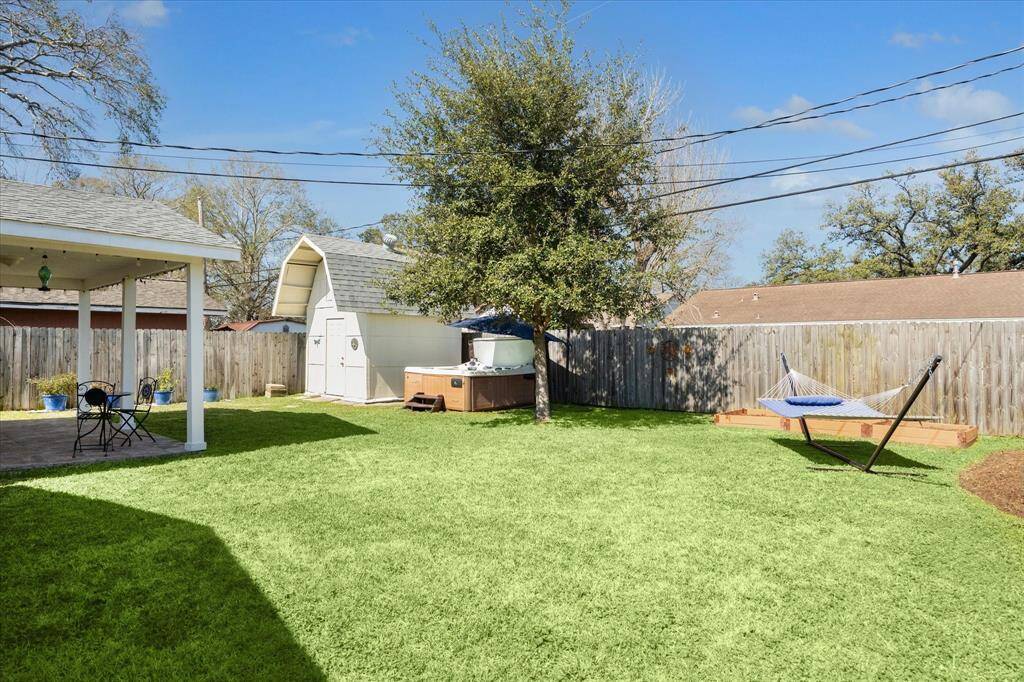 The spacious yard offers endless possibilities for outdoor enjoyment and recreation. Tend your garden in the raised beds, delicious BBQ, a spirited game of kickball, or simply unwinding outdoors.