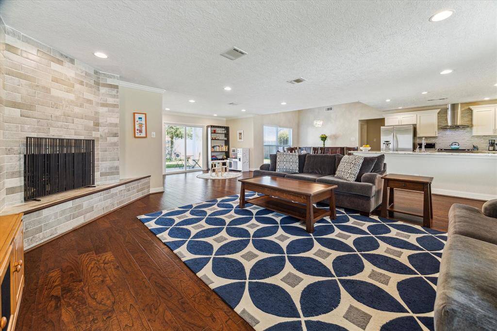 The open-concept living area features a neutral color palette, offering a bright and versatile space ready for your personal touch.