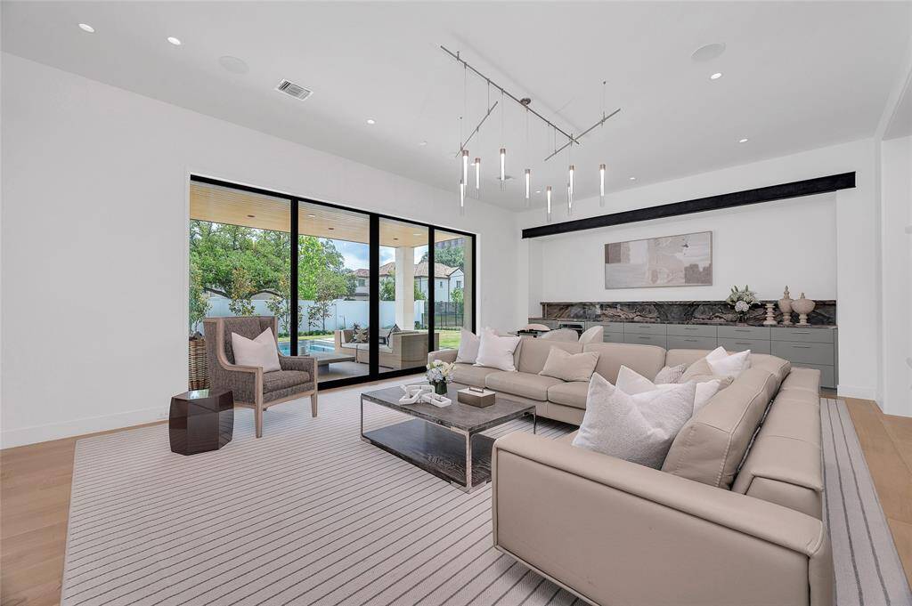 The home offers a very open concept with huge spaces that interrelate. This gorgeous kitchen checks all of the boxes and is perfectly on trend.