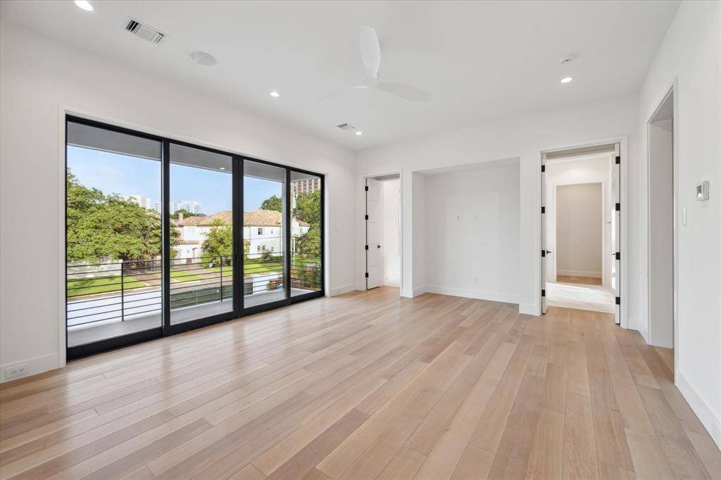 This is one of two expansive walk-in closets. With a dressing bench, packing station, soft close drawers, a make-up vanity with halo lighting and plenty of shoe shelving and rack space.