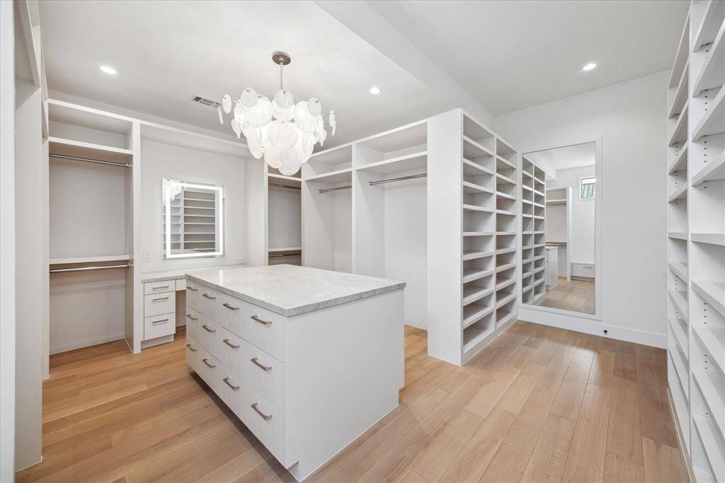 Virtually staged - There are a total of 4 bedrooms up. Each of these secondary bedrooms are very spacious and en-suite, each with their own bathrooms and walk-in closets.