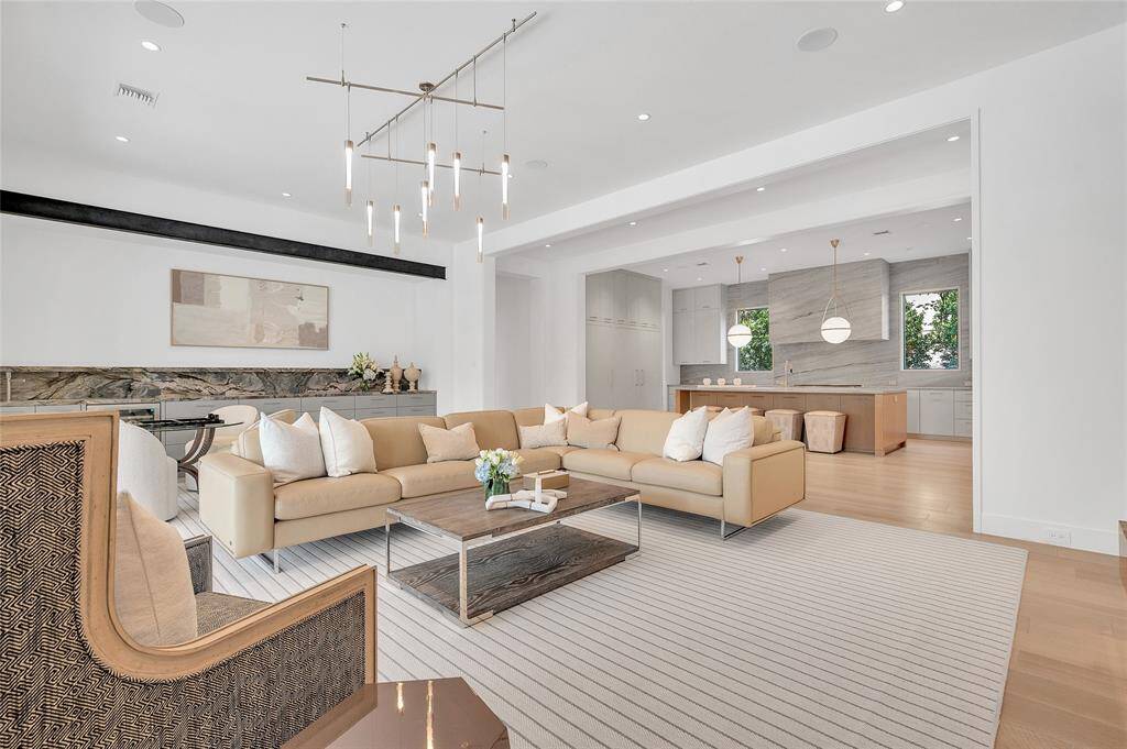Formal library with a dual sided fireplace and a beautiful blend of wood, stone and metal.