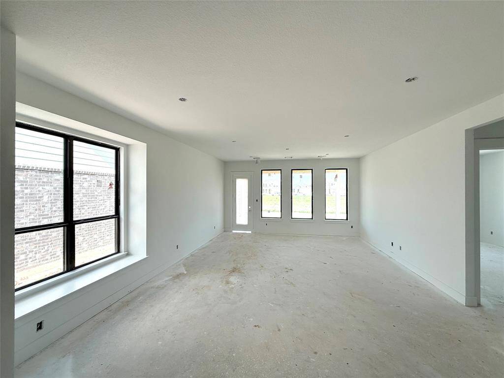 Imagine walking into a home that feels as expansive as it is inviting, bathed in natural l