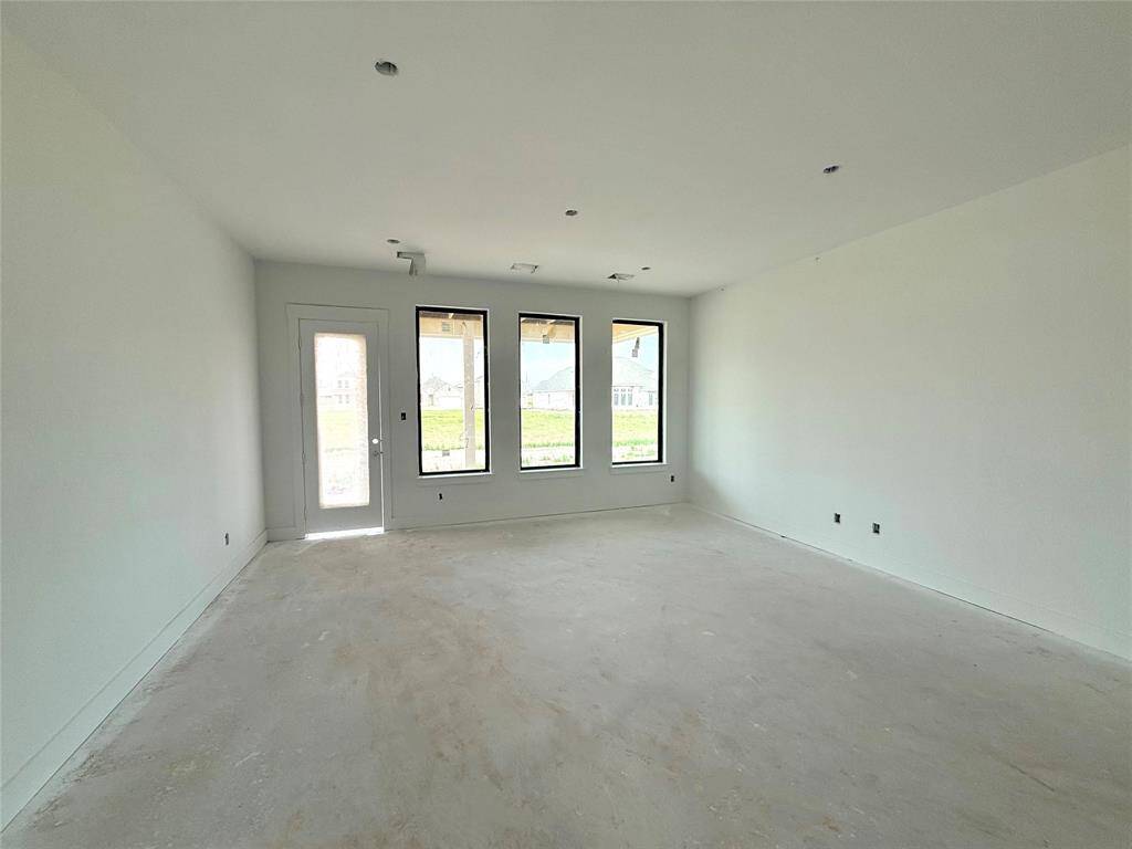 Picture expansive windows that invite natural light to dance through spacious living areas