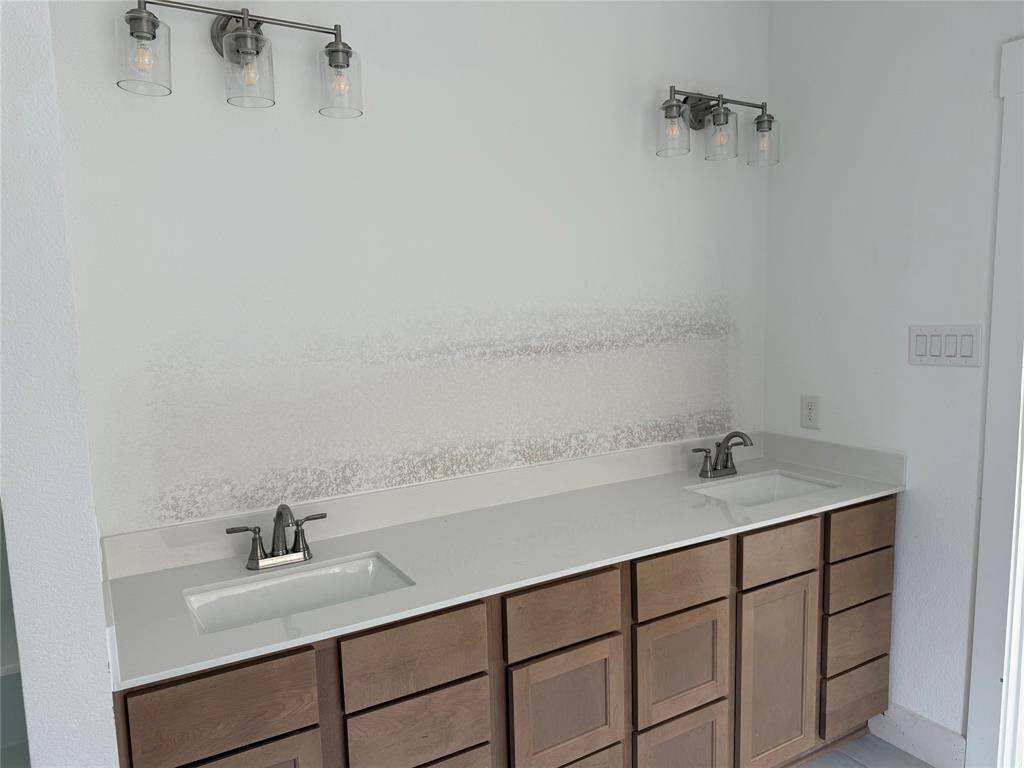 The elegant finishes, from the dazzling floors to the chic light fixtures, reflect a caref