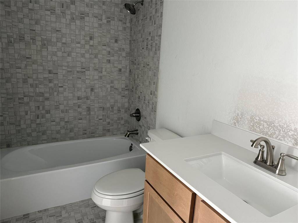 This stunning new construction boasts sleek lines and a modern aesthetic, blending style