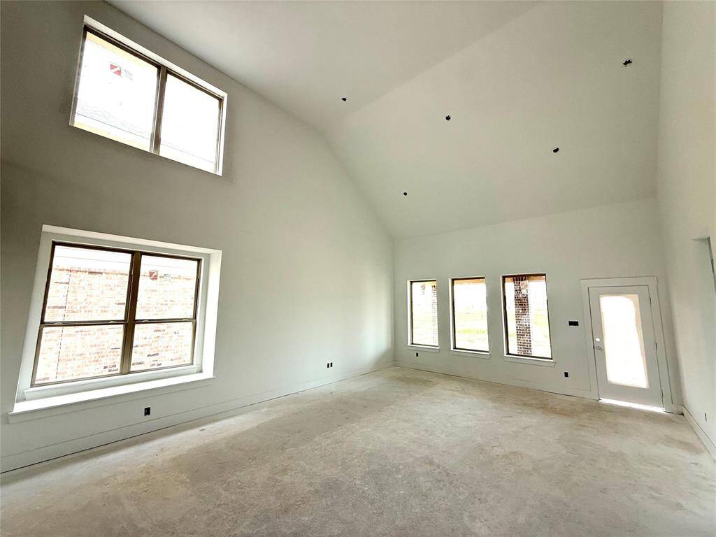 As you wander through the open floor plan, you’ll notice high ceilings that elevate the am