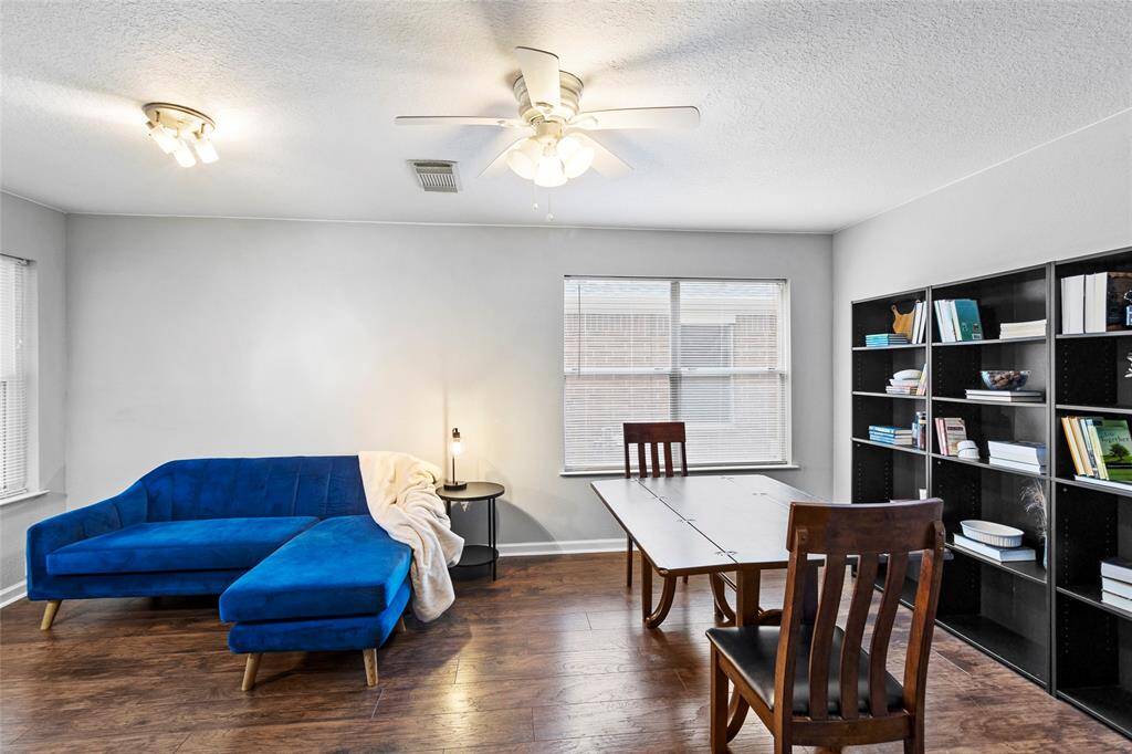 Take another look at your flex space, located at the front of your home. This frame showcases its spacious layout, where natural light pours in through large windows, enhancing the room’s airy feel.