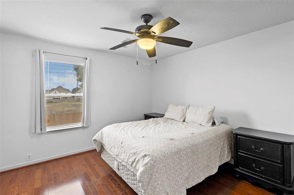 Your secondary bedroom is a cozy and functional space, thoughtfully designed for comfort and versatility. Ample natural light fills the room, creating a bright and inviting atmosphere.